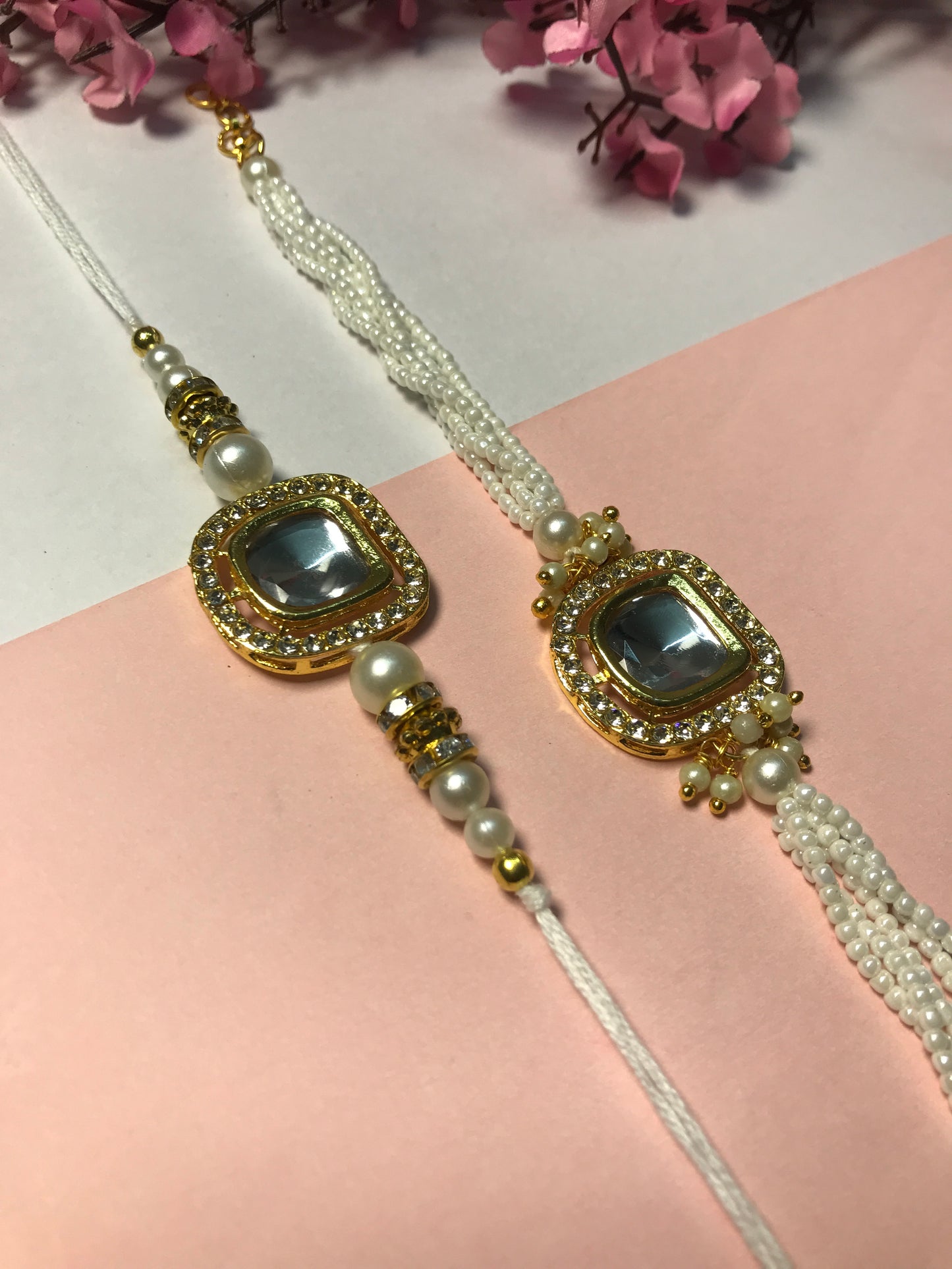 Royal White Kundan Rakhi for Brother – Handmade Designer Rakhi with Pearl Chain & Golden Detailing