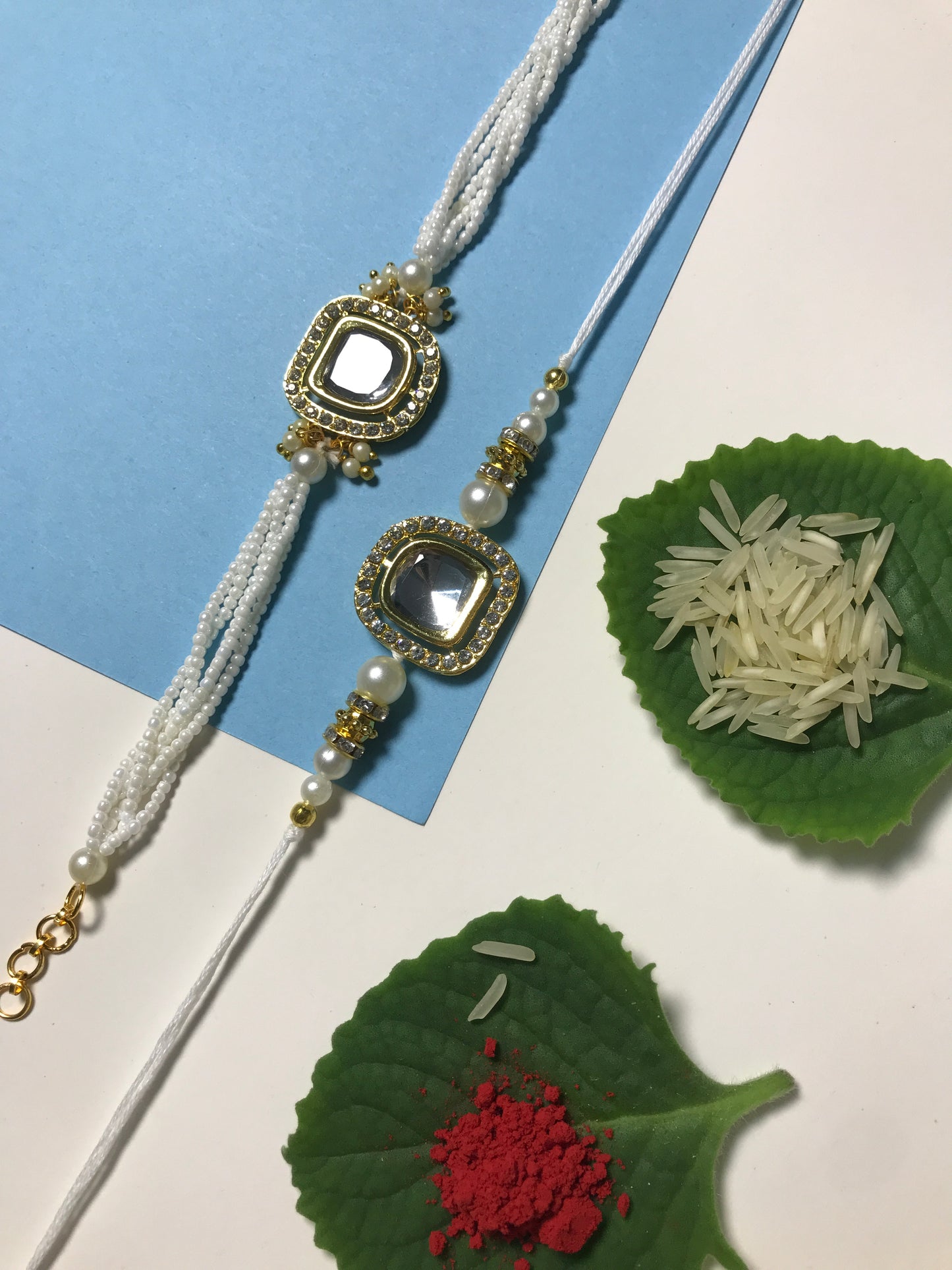 Royal White Kundan Rakhi for Brother – Handmade Designer Rakhi with Pearl Chain & Golden Detailing