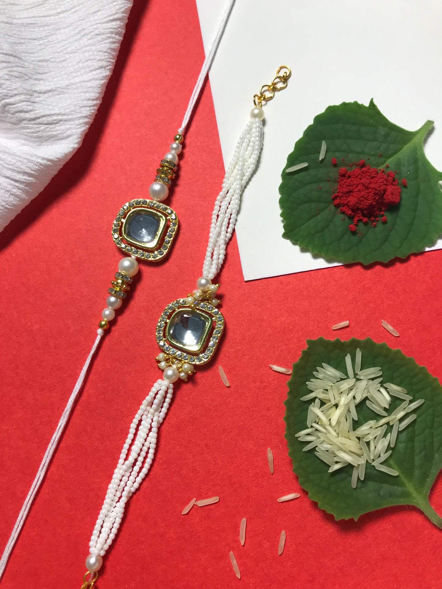 Royal White Kundan Rakhi for Brother – Handmade Designer Rakhi with Pearl Chain & Golden Detailing
