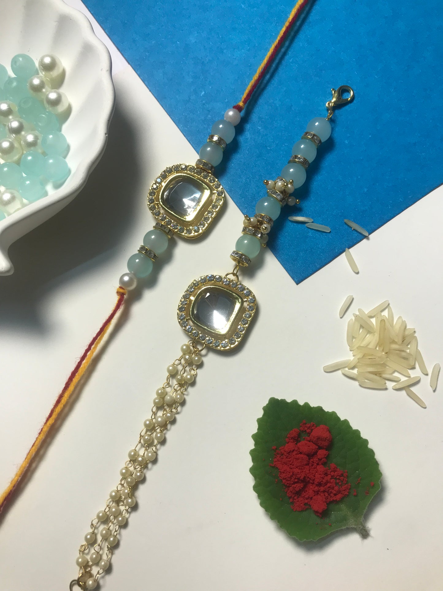 Elegant Mint Stone Rakhi for Brother – Handmade Rakhi with Blue Beads & Designer Pearl Chain