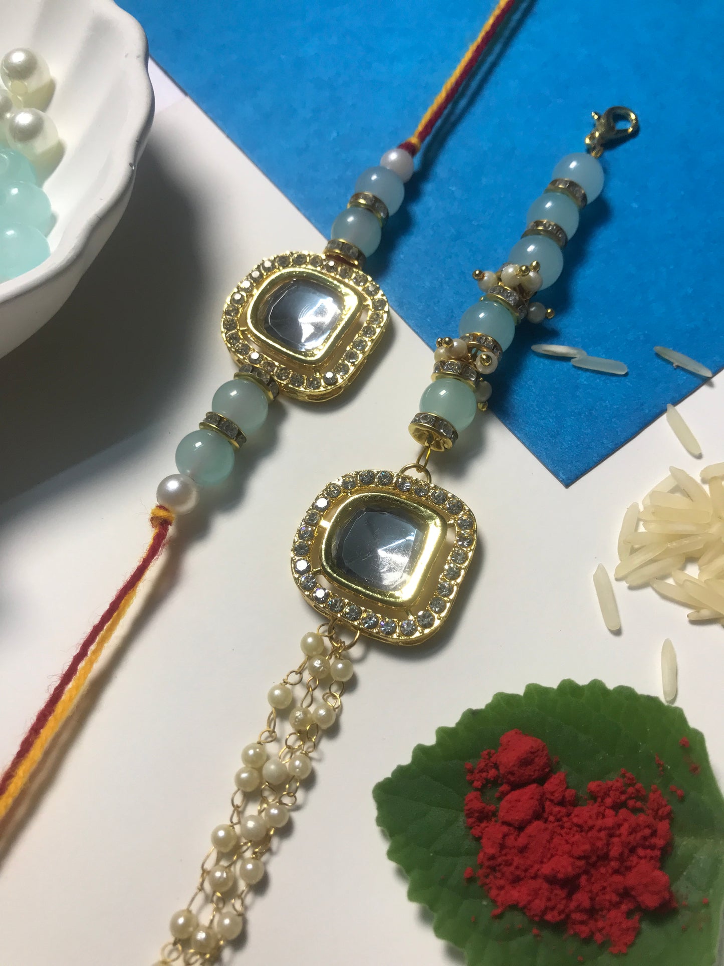 Elegant Mint Stone Rakhi for Brother – Handmade Rakhi with Blue Beads & Designer Pearl Chain