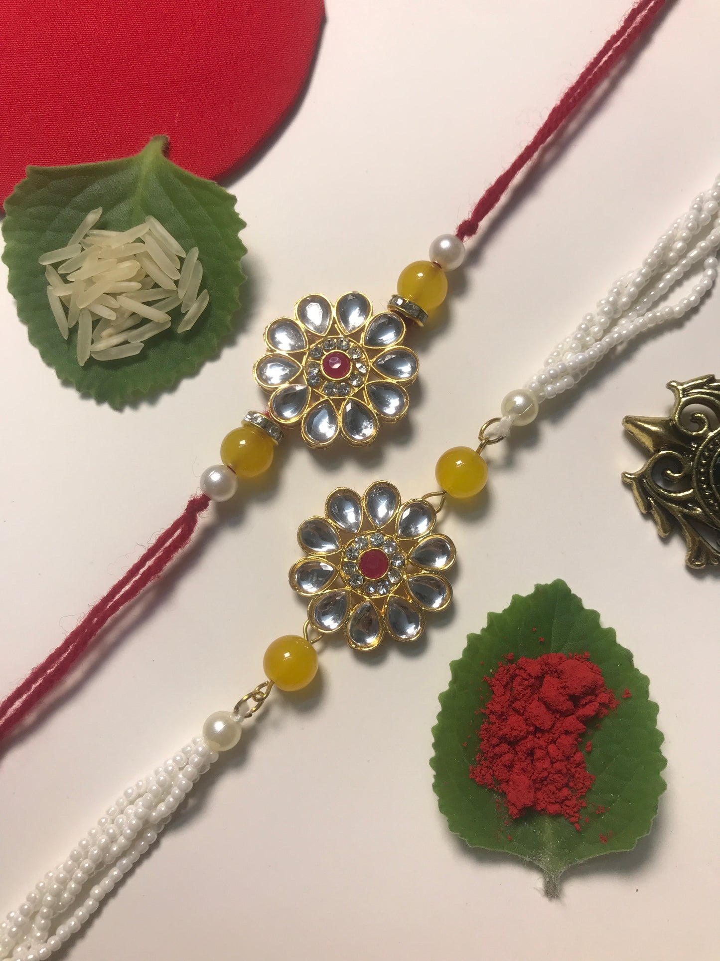Classic Kundan Rakhi for Brother – Handmade Designer Rakhi with Pearl Chain & Yellow Beads